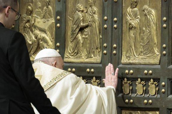 Pope Francis opens the Holy Door to mark the opening of the 2025 Catholic Holy Year, or Jubilee, in St. Peter's Basilica, at the Vatican, Dec. 24, 2024. (Remo Casilli/Pool Photo via AP)