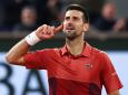 Serbia's Novak Djokovic celebrates after a point as he plays against Italy's Lorenzo Musetti during their men's singles match on Court Philippe-Chatrier on day seven of the French Open tennis tournament at the Roland Garros Complex in Paris on June 2, 2024. (Photo by EMMANUEL DUNAND / AFP)