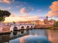 Rimini cityscape. Tiberius bridge famous sightseeing in Rimini at dawn. Summer sunrise in Rimini historic center