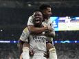 Real Madrid's Vinicius Junior celebrates with Rodrygo after scoring his side's second goal during the Champions League final soccer match between Borussia Dortmund and Real Madrid at Wembley stadium in London, Sunday, June 2, 2024. (AP Photo/Frank Augstein)