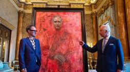LONDON, ENGLAND - MAY 14: Artist Jonathan Yeo and King Charles III stand in front of the portrait of the King Charles III by artist Jonathan Yeo as it is unveiled in the blue drawing room at Buckingham Palace on May 14, 2024 in London, England. The portrait was commissioned in 2020 to celebrate the then Prince of Wales's 50 years as a member of The Drapers' Company in 2022. The artwork depicts the King wearing the uniform of the Welsh Guards, of which he was made Regimental Colonel in 1975. The canvas size - approximately 8.5 by 6.5 feet when framed - was carefully considered to fit within the architecture of Drapers' Hall and the context of the paintings it will eventually hang alongside. Jonathan Yeo had four sittings with the King, beginning when he was Prince of Wales in June 2021 at Highgrove, and later at Clarence House. The last sitting took place in November 2023 at Clarence House. Yeo also worked from drawings and photographs he took, allowing him to work on the portrait in his London studio between sittings. (Photo by Aaron Chown-WPA Pool/Getty Images)