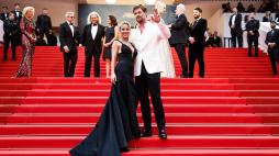 Australian actor Chris Hemsworth (R) and Spanish actress Elsa Pataky arrive for the screening of the film "Furiosa: A Mad Max Saga" at the 77th edition of the Cannes Film Festival in Cannes, southern France, on May 15, 2024. (Photo by Sameer Al-Doumy / AFP)