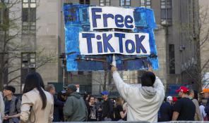 FILE - A man carries a Free TikTok sign in front of the courthouse where the hush-money trial of Donald Trump got underway April 15, 2024, in New York. The House has passed legislation Saturday, April 20, to ban TikTok in the U.S. if its China-based owner doesn't sell its stake, sending it to the Senate as part of a larger package of bills that would send aid to Ukraine and Israel. House Republicans' decision to add the TikTok bill to the foreign aid package fast-tracked the legislation after it had stalled in the Senate. The aid bill is a priority for President Joe Biden that has broad congressional support. (AP Photo/Ted Shaffrey, File)