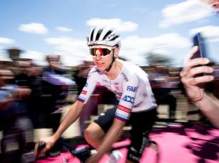 TOPSHOT - Team UAE's Slovenian rider Tadej Pogacar arrives to take part in the stage 1 of the Giro d'Italia 2024 cycling race, 140 km between Venaria Reale and Torino on May 4, 2024. The 107th edition of the Giro d'Italia, with a total of 3400,8 km, departs from Veneria Reale near Turin on May 4, 2024 and will finish in Rome on May 26, 2024. (Photo by MARCO BERTORELLO / AFP)