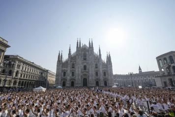 Thousands of young dancers attend the 'white dance' during the event 'One Dance' directed by Italian renowned dancer Roberto Bolle, in front of the Duomo gothic cathedral, in Milan, Italy, Sunday, Sept. 10, 2023. (AP Photo/Luca Bruno)
