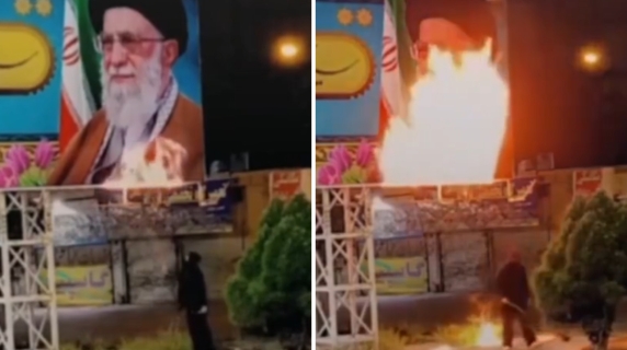 La sfida all'ayatollah: un uomo a volto coperto appicca il fuoco al ritratto della Guida suprema Ali Khamenei