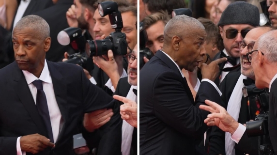 Denzel Washington contro un fotografo sul red carpet a Cannes, si divincola e punta il dito: «Smettila!»