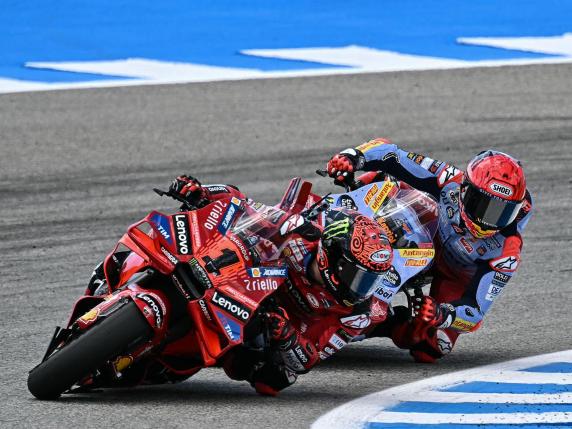 TOPSHOT - Ducati Italian rider Francesco Bagnaia (Front) and Ducati Spanish rider Marc Marquez compete during the MotoGP Spanish Grand Prix race at the Jerez racetrack in Jerez de la Frontera on April 28, 2024. (Photo by JORGE GUERRERO / AFP)