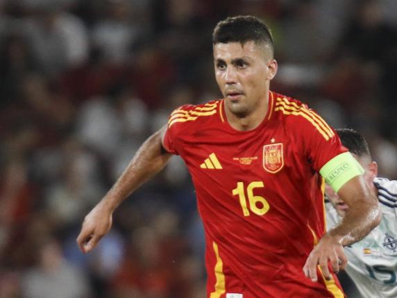 Spain's Rodri dribbles the ball during the international friendly soccer match between Spain and Northern Ireland at the Son Moix stadium in Palma de Mallorca, Spain, Saturday, June 8, 2024. (AP Photo/Francisco Ubilla)