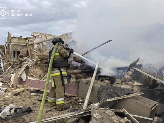 In this photo provided by the Ukrainian Emergency Service, emergency services personnel work to extinguish a fire following a Russian attack in Donetsk region, Ukraine, Wednesday, July 2, 2025. (Ukrainian Emergency Service via AP)