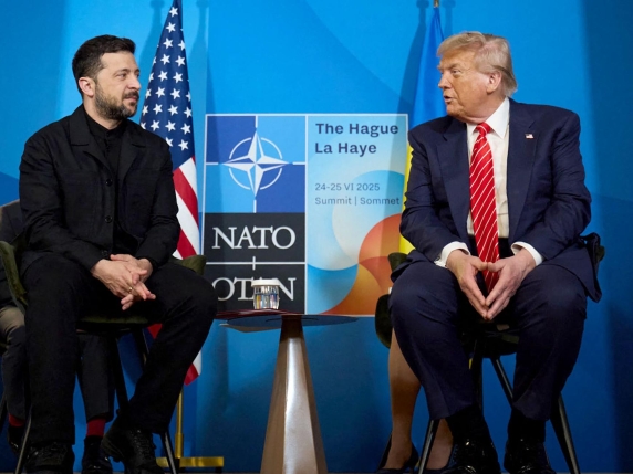 (FILES) In this handout photograph taken and released by the Ukrainian Presidential Press Service on June 25, 2025, Ukraine's President Volodymyr Zelensky (L) meets with US President Donald Trump on the sideline of the North Atlantic Treaty Organization (NATO) summit in The Hague. Ukraine appealed to the United States for clarity on July 1, 2025, after it was caught off guard by a White House announcement that Washington was halting some arms shipments to the war-battered country. The White House had said that it was halting some key weapons shipments promised by the previous US administration, without elaborating. (Photo by Handout / UKRAINIAN PRESIDENTIAL PRESS SERVICE / AFP) / RESTRICTED TO EDITORIAL USE - MANDATORY CREDIT "AFP PHOTO / Ukrainian Presidential Press Service" - NO MARKETING NO ADVERTISING CAMPAIGNS - DISTRIBUTED AS A SERVICE TO CLIENTS