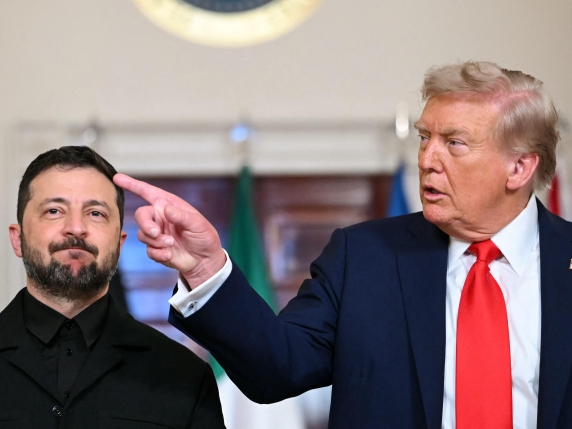 (L/R) Ukrainian President Volodymyr Zelensky and US President Donald Trump stand for a family photo with other European leaders in the Cross Hall of the White House in Washington, DC, on August 18, 2025. European leaders join Ukrainian President V...