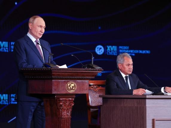 In this pool photograph distributed by the Russian state agency Sputnik, Russia's President Vladimir Putin gives a speech at a meeting of the Russian Geographical Society in Moscow on October 23, 2025. (Photo by Vyacheslav PROKOFYEV / POOL / AFP)