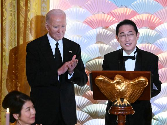 US President Joe Biden applauds as Japanese Prime Minister Fumio Kishida speaks during a State Dinner in the East Room of the White House in Washington, DC, April 10, 2024. (Photo by Mandel NGAN / AFP)