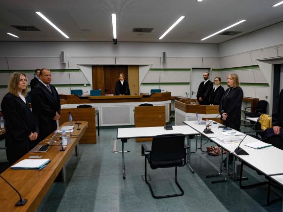 Judge Barbara Lueders (C), flanked by the defence lawyers (L) and plaintiff representatives (R) are seen in Tiergarten district court room 129 in Berlin on May 31, 2024, prior to the start of an appeal by German tennis player Alexander Zverev against a fine for allegedly assaulting his ex-girlfriend. Zverev, the world number four player, received a 450,000-euro ($487,000) fine in October 2023 but has appealed the ruling. The 27-year-old indicated is skipping the opening of the proceedings in Berlin, which falls in the middle of the two-week French Open tennis tournament. (Photo by Odd ANDERSEN / AFP)
