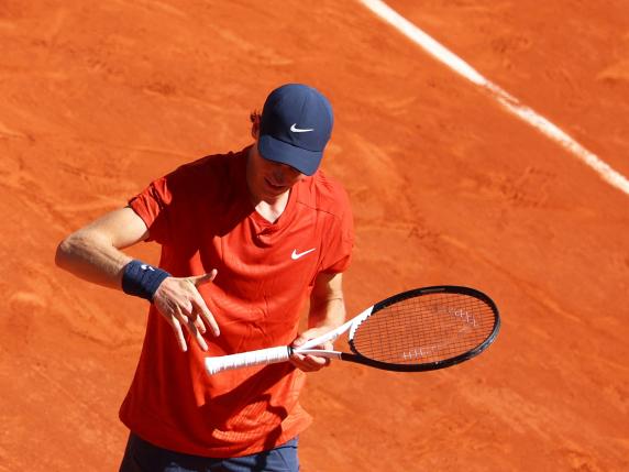 Italy's Jannik Sinner relaxes his hand during his men's singles semi final match against Spain's Carlos Alcaraz on Court Philippe-Chatrier on day thirteen of the French Open tennis tournament at the Roland Garros Complex in Paris on June 7, 2024. (Photo by Emmanuel Dunand / AFP)