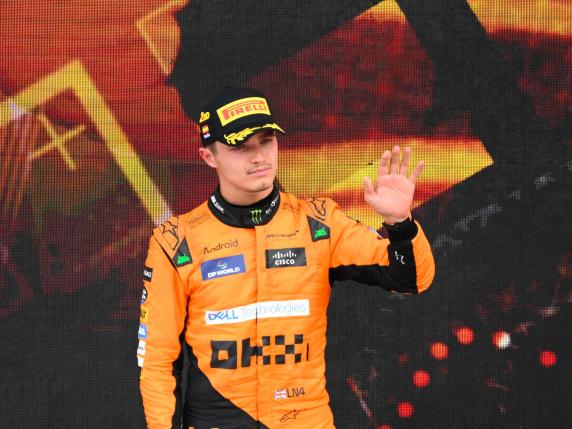 Second placed McLaren's British driver Lando Norris stands on the podium after the Spanish Formula One Grand Prix at the Circuit de Catalunya on June 23, 2024 in Montmelo, on the outskirts of Barcelona. (Photo by Josep LAGO / AFP)