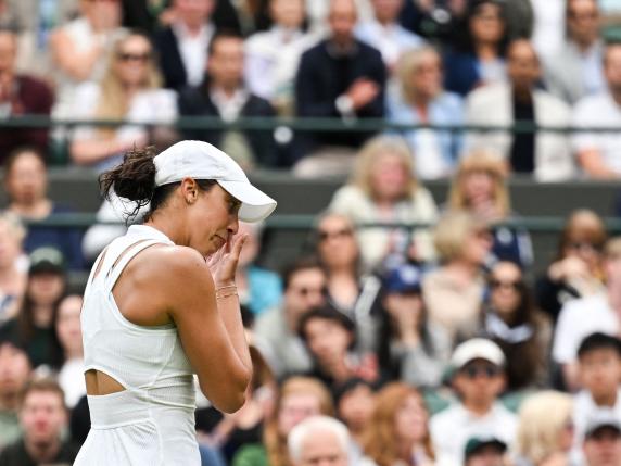US player Madison Keys cries as she retires from her women's singles tennis match against Italy's Jasmine Paolini following a thigh injury on the seventh day of the 2024 Wimbledon Championships at The All England Lawn Tennis and Croquet Club in Wimbledon, southwest London, on July 7, 2024. (Photo by ANDREJ ISAKOVIC / AFP) / RESTRICTED TO EDITORIAL USE