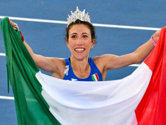 Italy's Antonella Palmisano celebrates winning the women's 20km race walk final during the European Athletics Championships at the Olympic stadium in Rome on June 7, 2024. (Photo by Andreas SOLARO / AFP)