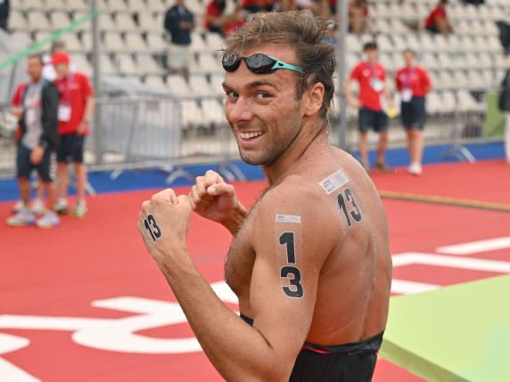 Gold medallist Italy's Gregorio Paltrinieri celebrates after the Open Water Men's 10km race during the LEN European Aquatics Championships, at the Ada Ciganlija lake in Belgrade, on June 12, 2024. (Photo by Andrej ISAKOVIC / AFP)