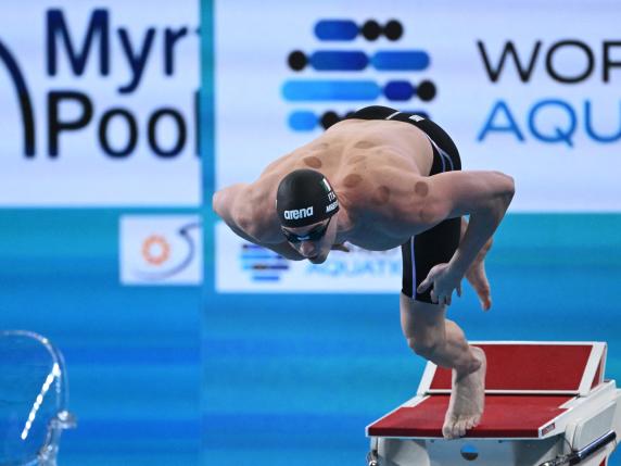 Italy's Alessandro Miressi competes in a semi-final of the men's 100m freestyle swimming event during the 2024 World Aquatics Championships at Aspire Dome in Doha on February 14, 2024. (Photo by SEBASTIEN BOZON / AFP)