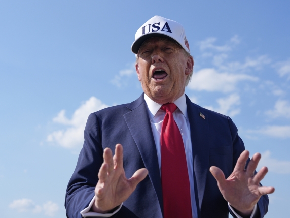 President Donald Trump talks to reporters before boarding Air Force One, Thursday, July 3, 2025, at Joint Base Andrews, Md. (AP Photo/Alex Brandon)