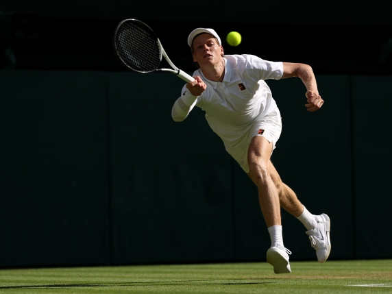 LONDON, ENGLAND - JULY 13: Jannik Sinner of Italy plays a forehand against Carlos Alcaraz of Spain during the Gentleman's Singles Final on day fourteen of The Championships Wimbledon 2025 at All England Lawn Tennis and Croquet Club on July 13, 2025 in London, England. (Photo by Julian Finney/Getty Images)