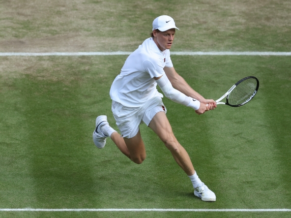 LONDON, ENGLAND - JULY 13: Jannik Sinner of Italy plays a backhand against Carlos Alcaraz of Spain during the Gentleman's Singles Final on day fourteen of The Championships Wimbledon 2025 at All England Lawn Tennis and Croquet Club on July 13, 2025 in London, England. (Photo by Ezra Shaw/Getty Images)