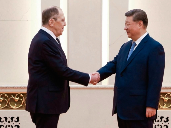 In this photo released by Russian Foreign Ministry Spokeswoman Maria Zakharova on Telegram messaging app on Tuesday, July 15, 2025, Chinese President Xi Jinping, right, shakes hands with Russian Foreign Minister Sergey Lavrov during their meeting on the sidelines of Shanghai Cooperation Organisation Foreign Ministers meeting in Beijing, China. (Russian Foreign Ministry Spokeswoman Maria Zakharova via AP)