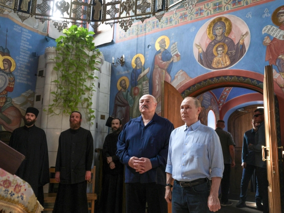 In this pool photograph distributed by the Russian state agency Sputnik, Russia's President Vladimir Putin and Belarusian President Alexander Lukashenko visit the Valaam Monastery on Valaam island in the northern portion of Lake Ladoga on August 1...