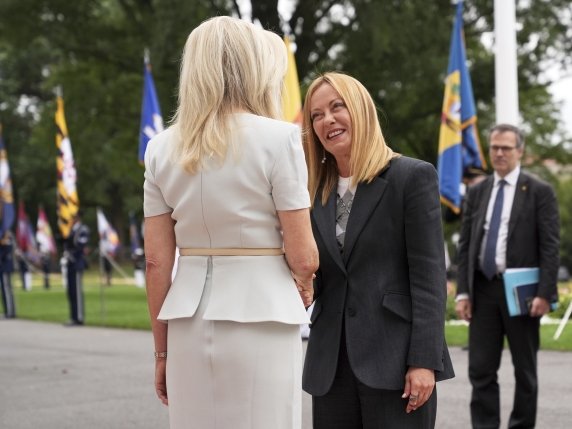 Monica Crowley, White House chief of protocol, left, greets Italy's Prime Minister Giorgia Meloni upon arriving to meet with President Donald Trump and Ukraine's President Volodymyr Zelenskyy, Monday, Aug. 18, 2025, at the South Portico of the Whi...