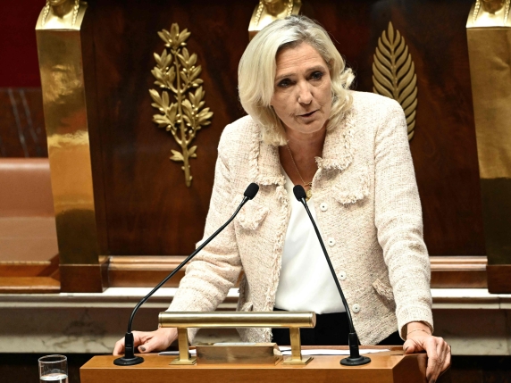 President of Rassemblement National parliamentary group Marine Le Pen delivers a speech following prime Minister's general policy statement during the parliamentary extraordinary session prior to a confidence vote over the government's austerity b...