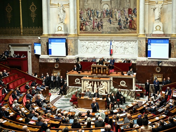 France's Prime Minister Francois Bayrou (C) delivers a speech prior to a confidence vote over the government's austerity budget, at the National Assembly in Paris on September 8, 2025. France's parliament is expected to oust Prime Minister Francoi...