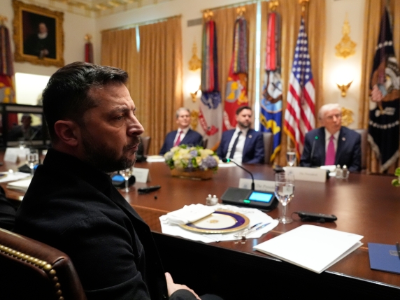 Ukraine's President Volodymyr Zelenskyy, left, speaks before a lunch with President Donald Trump, from right, Vice President JD Vance and Treasury Secretary Scott Bessent in the Cabinet Room of the White House, Friday, Oct. 17, 2025, in Washington...