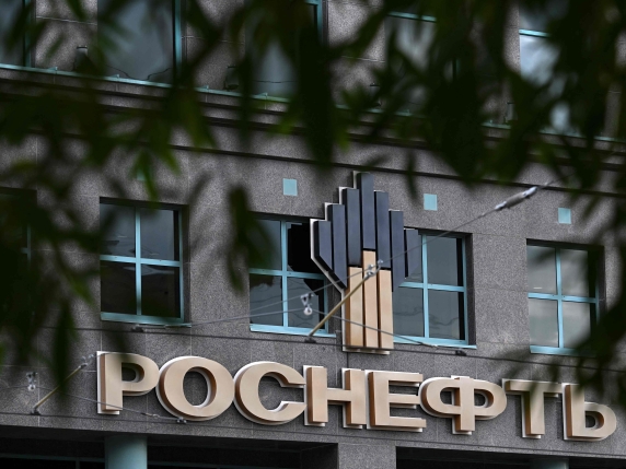 The logo of Russia's Rosneft oil producer sits on the facade of an office building in Moscow on October 23, 2025. Russia said on October 23, 2025 that new US sanctions on its oil industry risked hurting diplomatic efforts to end the Ukraine war, a...
