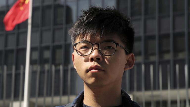 FILE - Pro-democracy activist Joshua Wong stands outside the Legislative Council building in Hong Kong on Nov. 28, 2019. (AP Photo/Kin Cheung, File)