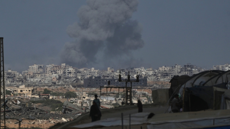 Smoke rises following an Israeli military strike in Gaza City, as seen from the central Gaza Strip, Sunday, Oct. 5, 2025. (AP Photo/Abdel Kareem Hana)
