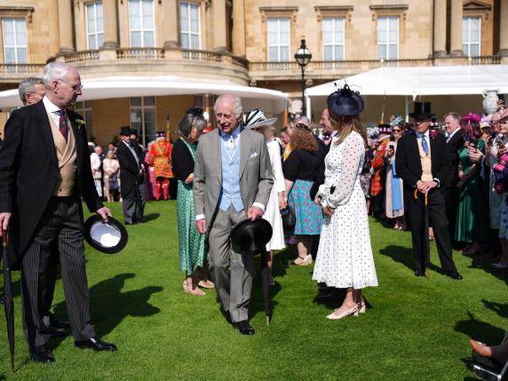 Britain's King Charles III reacts as he meets guests during a Royal Garden Party at Buckingham Palace, central London, on May 8, 2024. (Photo by Jordan Pettitt / POOL / AFP)