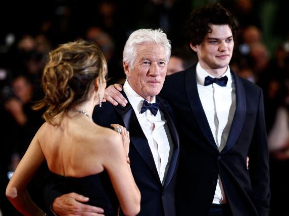 ( From L) Spanish Alejandra Silva, US actor Richard Gere, US actor Homer James Jigme Gere arrive for the screening of the film "Oh Canada" at the 77th edition of the Cannes Film Festival in Cannes, southern France, on May 17, 2024. (Photo by Sameer Al-Doumy / AFP)