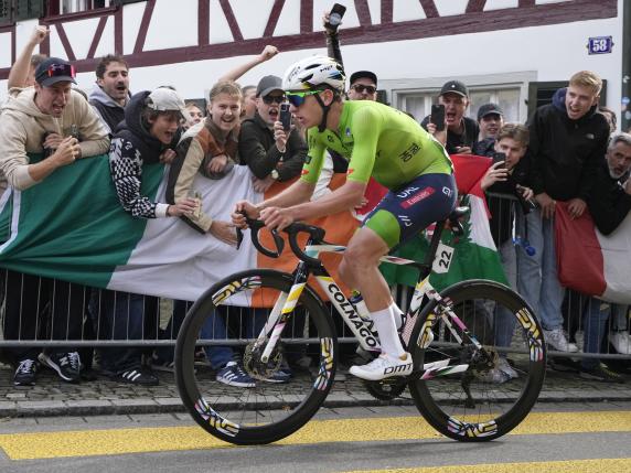 Slovenia's Tadej Pogacar attacks during the Men Elite road race of the Cycling and Para-cycling Road World Championships in Zurich, Switzerland, Sunday, Sept. 29, 2024. (AP Photo/Peter Dejong)