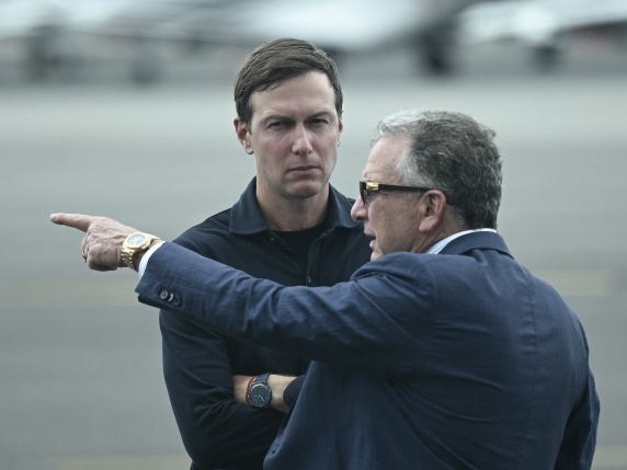 (FILES) US special envoy to the Middle East Steve Witkoff (R) and Jared Kushner await the arrival of President Donald Trump and First Lady Melania Trump at Teterboro Airport in Teterboro, New Jersey, on July 13, 2025. President Donald Trump's son-in-law Jared Kushner and Witkoff, a senior US envoy, are heading to Egypt on October 4, 2025, to finalize hostage release details, a White House official said, after Hamas reacted positively to a peace plan to end two years of war. (Photo by Brendan SMIALOWSKI / AFP)