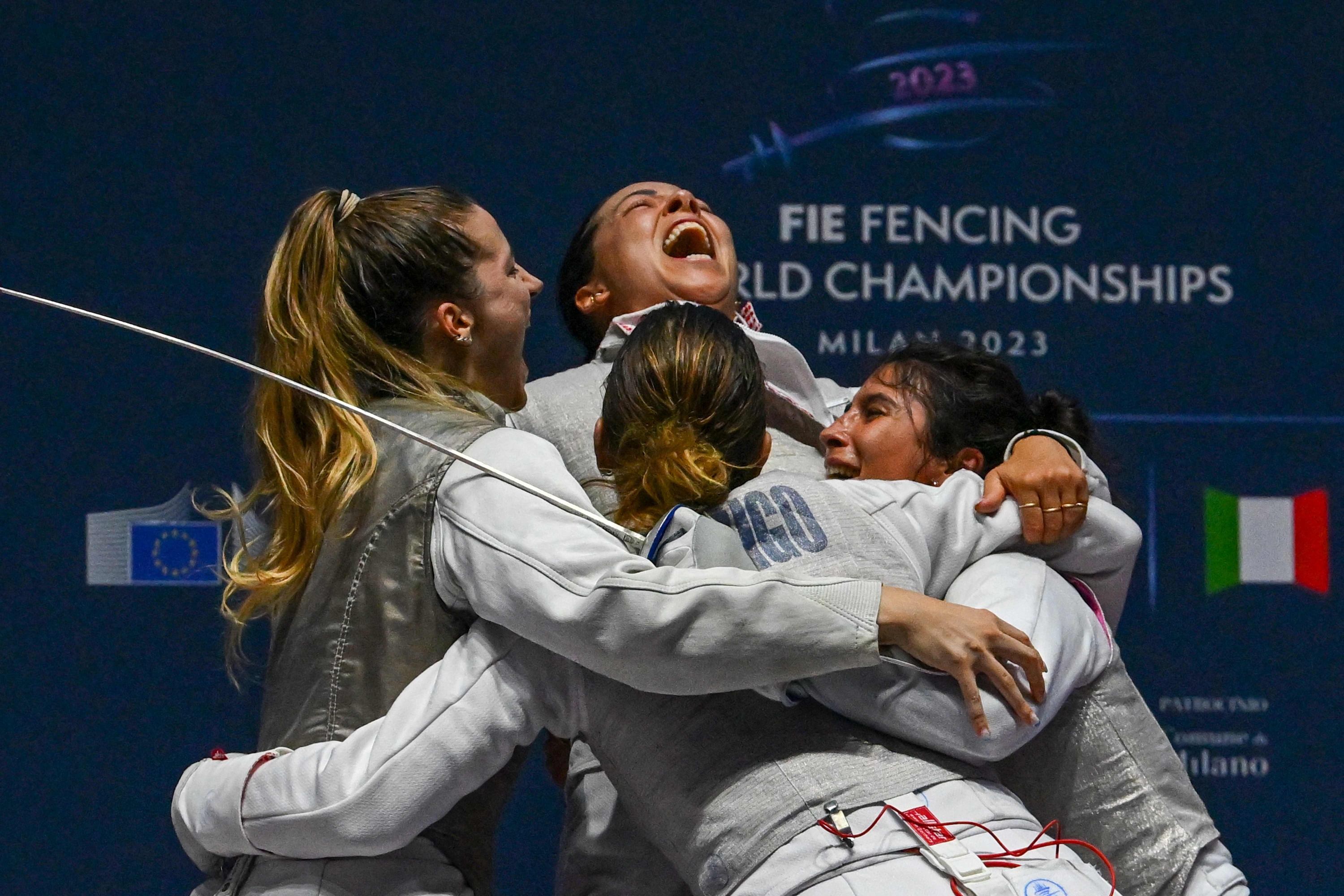 (Clockwise From L) Italy's Martina Favaretto, Italy's Alice Volpi, Italy's Francesca Palumbo and Italy's Arianna Errigo celebrate after defeating France's team to win the Women's Team Foil event Gold medal match, as part of the FIE Fencing World Championships at the Fair Allianz MI.CO (Milano Convegni) in Milan, on July 29, 2023. (Photo by Andreas SOLARO / AFP)