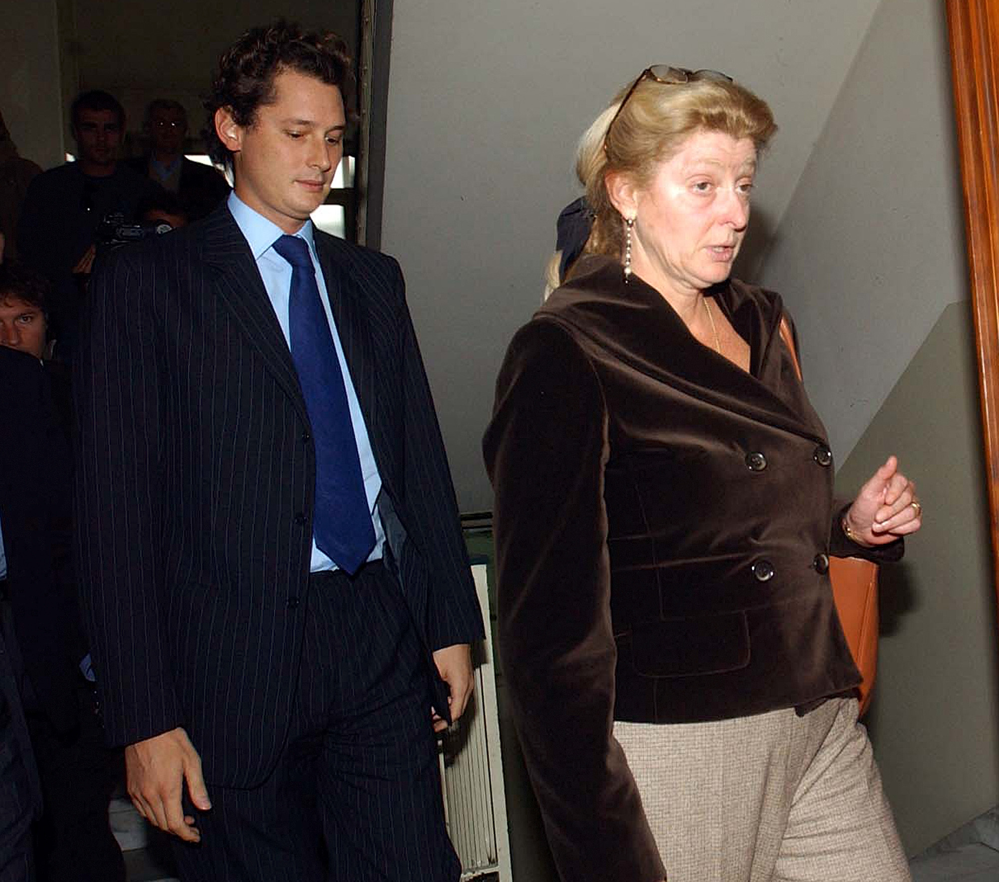 Margherita Agnelli, right, and her son John leave the Mauriziano hospital in Turin, Italy, Thursday Oct. 13, 2005 after visiting her son Lapo. Lapo Elkann, a member of Italy's Agnelli business dynasty continues to improve after being hospitalized in Turin for a drug overdose. (AP Photo/Massimo Pinca)