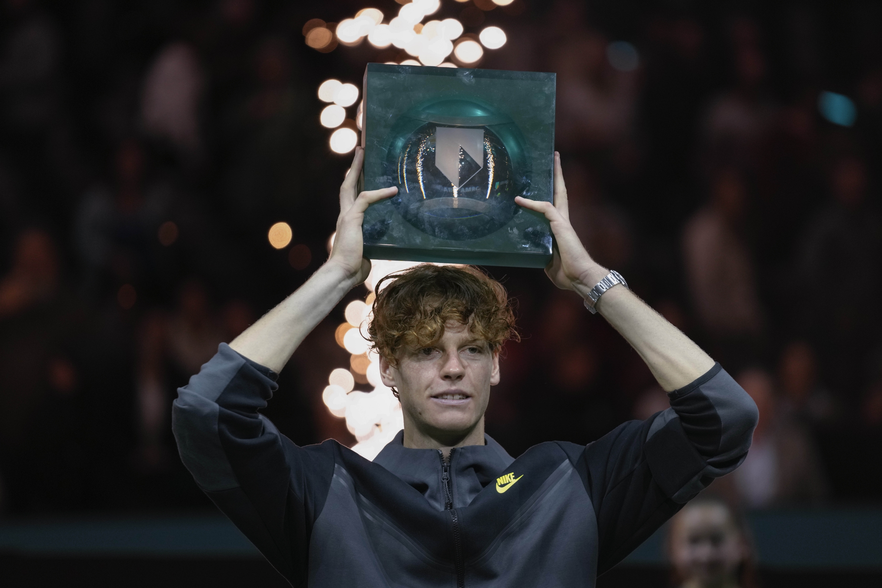 Italy's Jannik Sinner lifts the trophy as he celebrates winning the men's final of the ABN AMRO ATP tennis tournament against Australia's Alex De Minaur at Ahoy arena in Rotterdam, Netherlands, Sunday, Feb. 18, 2024. (AP Photo/Peter Dejong)