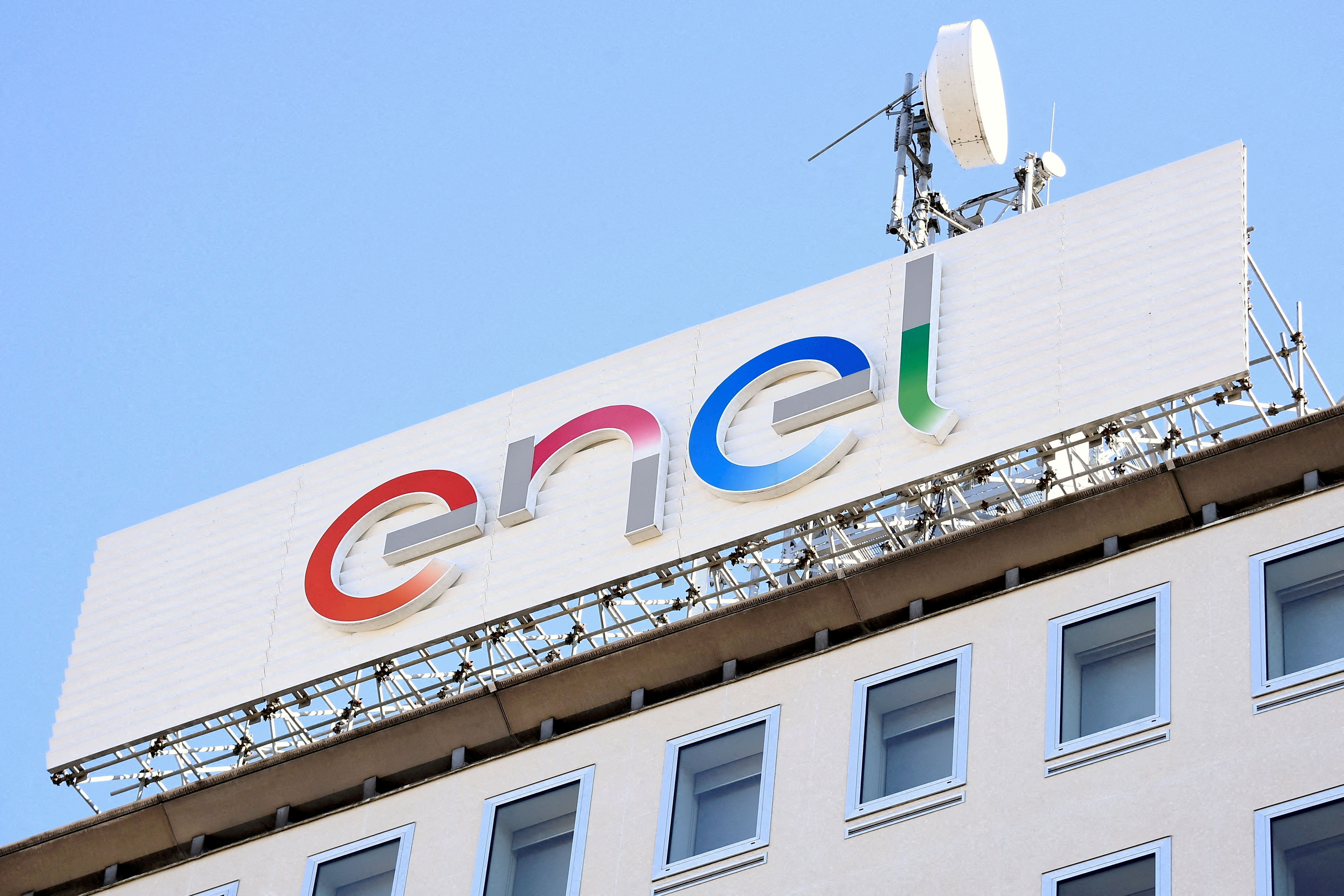 FILE PHOTO: A logo of Italian multinational energy company Enel is seen at the Milan's headquarters, Italy, February 5, 2020. REUTERS/Flavio Lo Scalzo