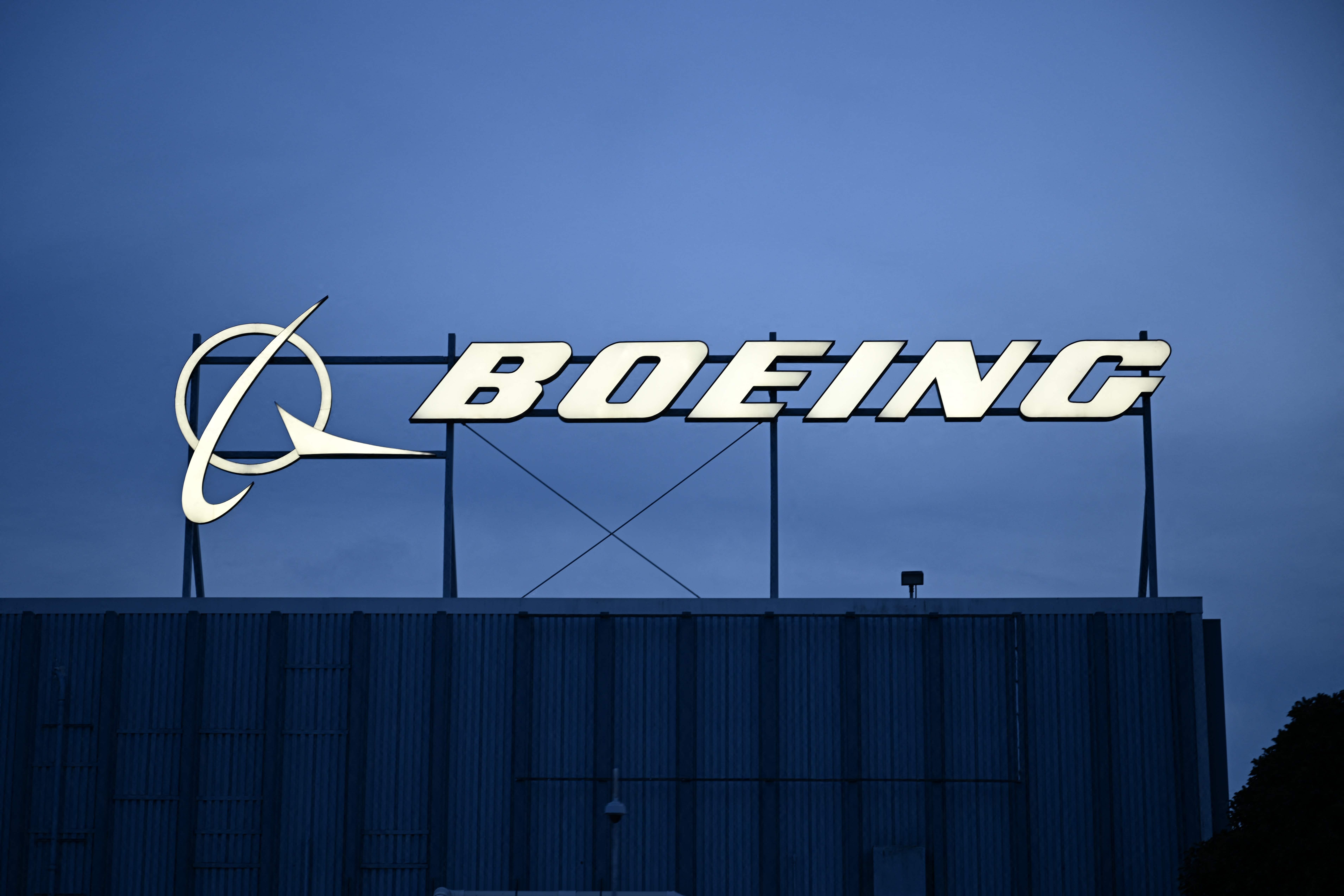 (FILES) The Boeing Co. logo is displayed outside of company offices near Los Angeles International Airport (LAX) in El Segundo, California on January 18, 2024. With the latest Boeing crisis, airlines are staring down more delays, a familiar problem in a market in which both the US giant and rival Airbus face supply chain constraints. (Photo by Patrick T. Fallon / AFP)