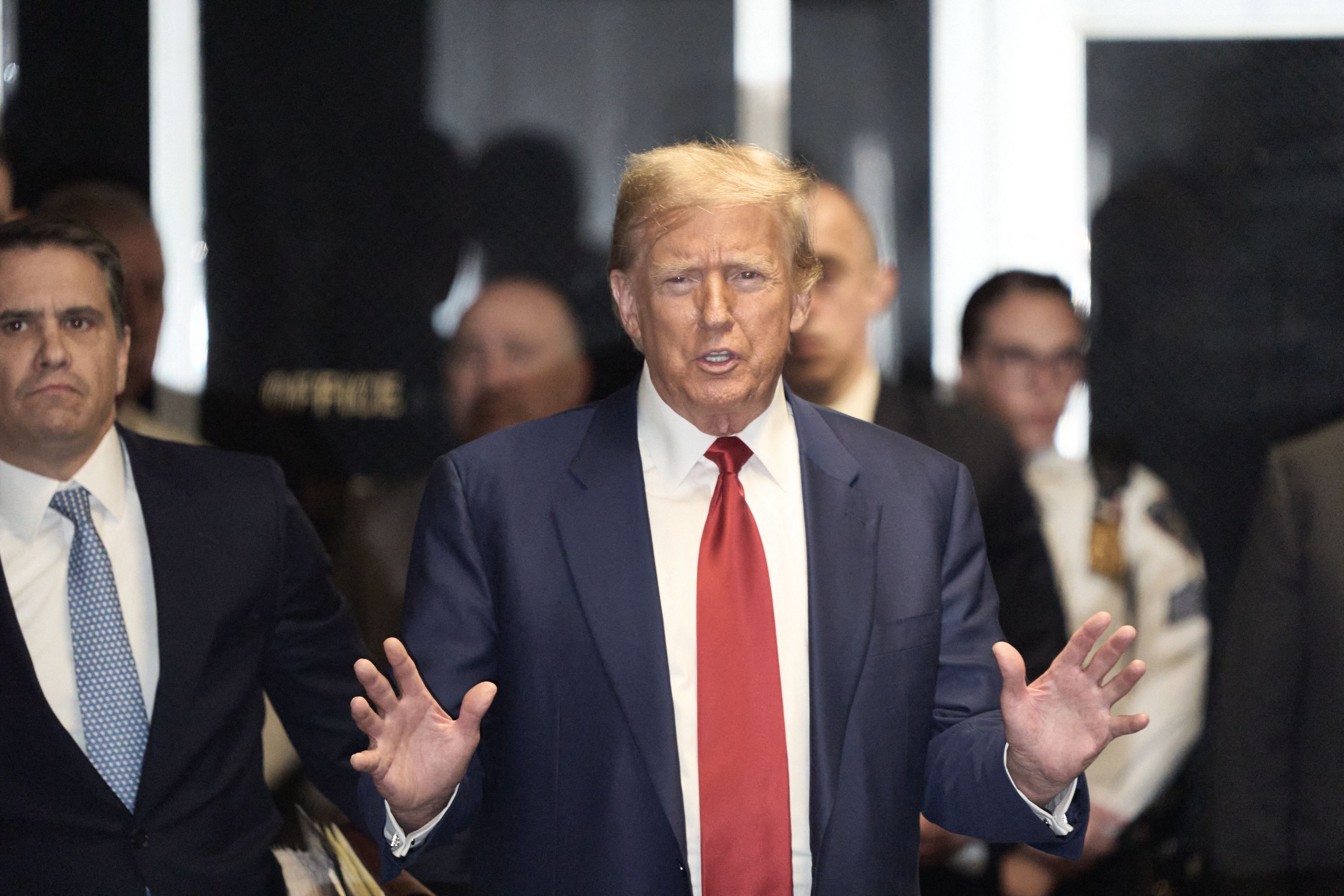 Former US President Donald Trump speaks to the press following a hearing to determine the date of his trial for allegedly covering up hush money payments linked to extramarital affairs at Manhattan Criminal Court in New York on March 25, 2024. A New York judge on Monday ordered former president Donald Trump's criminal trial on charges of paying pre-election hush money to a porn star to begin on April 15. (Photo by Curtis Means / POOL / AFP)