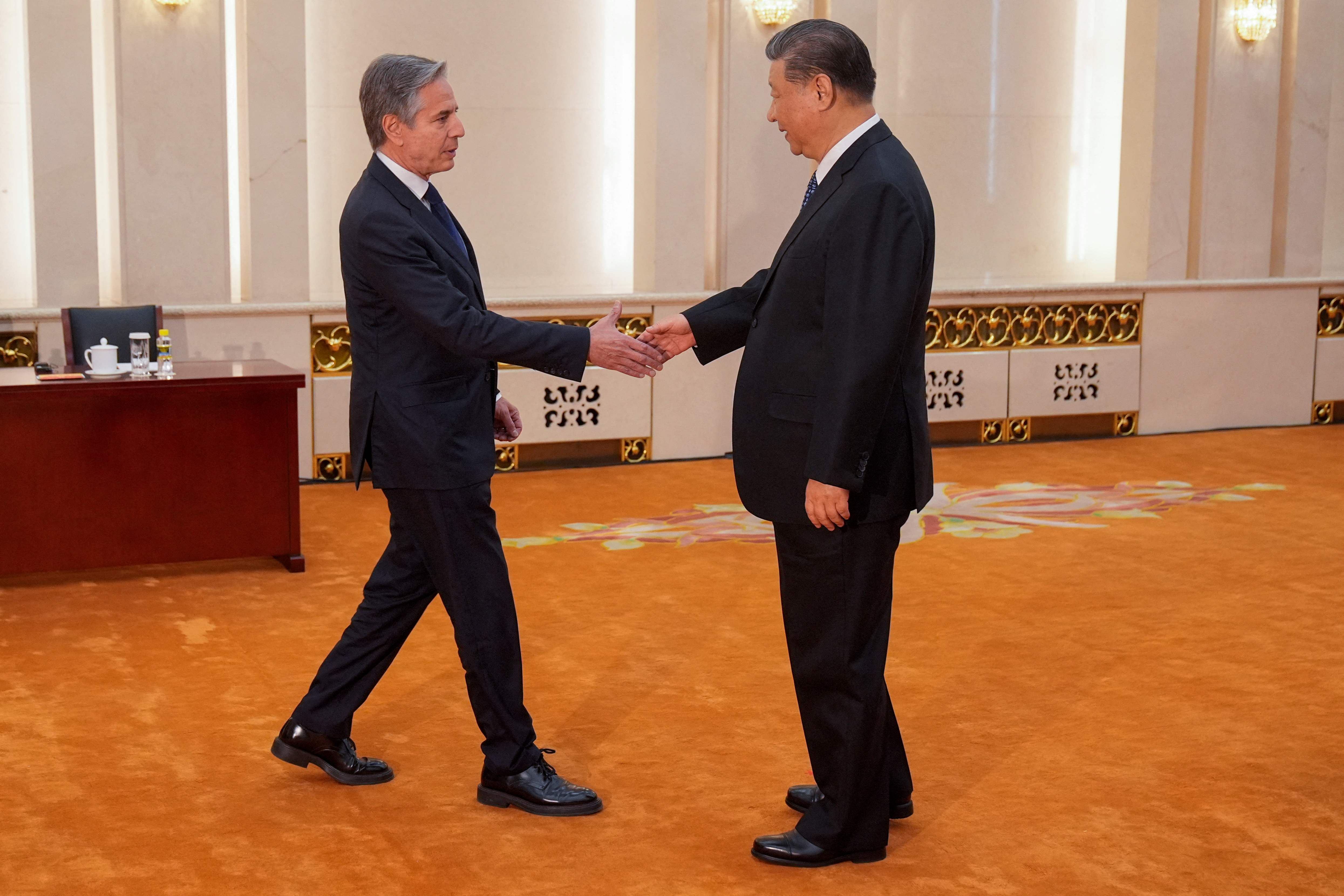 US Secretary of State Antony Blinken (L) shakes hands with China's President Xi Jinping at the Great Hall of the People in Beijing on April 26, 2024. (Photo by Mark Schiefelbein / POOL / AFP)