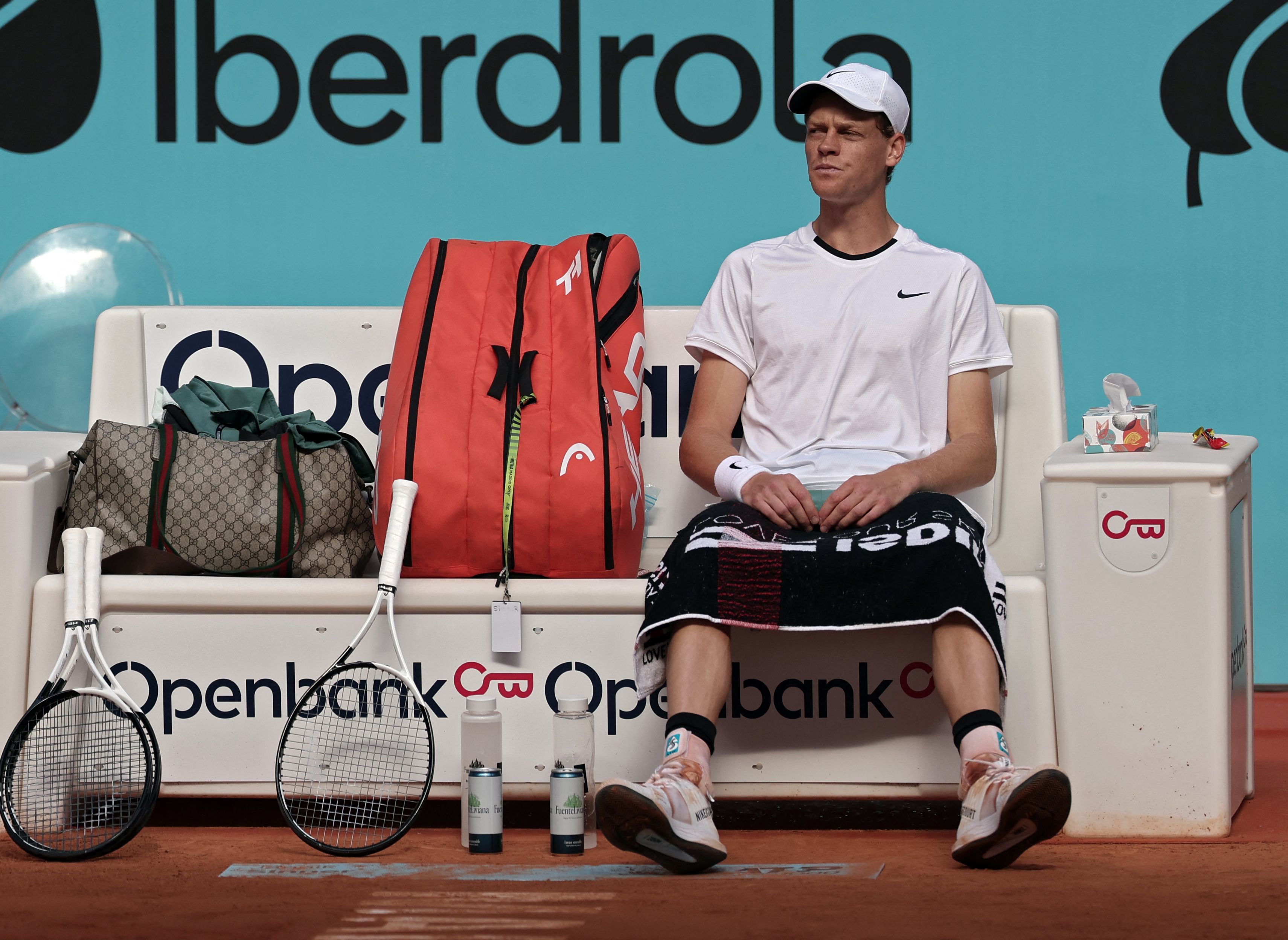 Italy's Jannik Sinner takes a break as he plays against Russia's Karen Khachanov during the fourth round of the 2024 ATP Tour Madrid Open tournament tennis match at Caja Magica in Madrid on April 30, 2024. (Photo by Thomas COEX / AFP)
