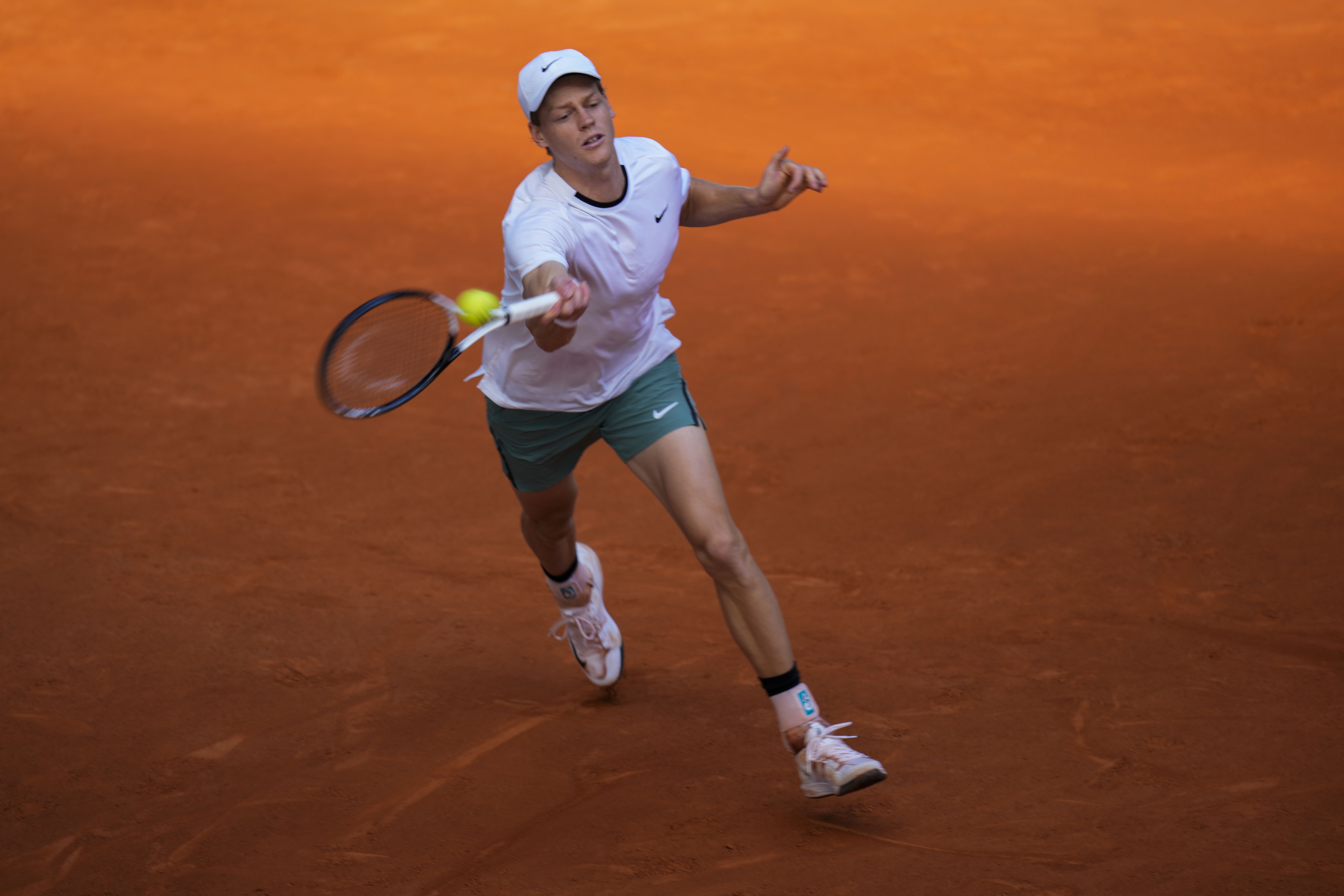 Jannik Sinner, of Italy, returns the ball to Karen Khachanov, of Russia, during the Mutua Madrid Open tennis tournament in Madrid, Tuesday, April 30, 2024. (AP Photo/Manu Fernandez)